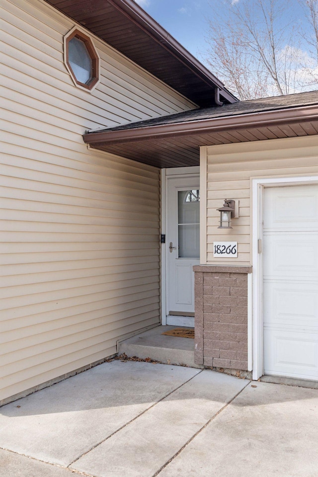 property entrance with an attached garage