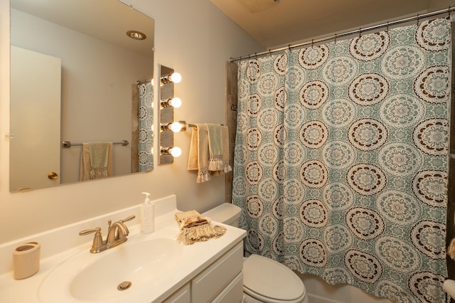 317 6th Ave SW Unit 501, Rochester, MN 55902 - full bathroom featuring toilet, vanity, and a shower with shower curtain