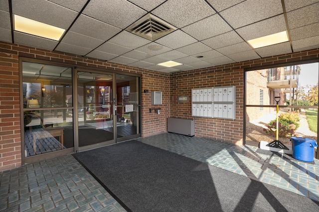 317 6th Ave SW Unit 501, Rochester, MN 55902 - common area with a drop ceiling and brick wall