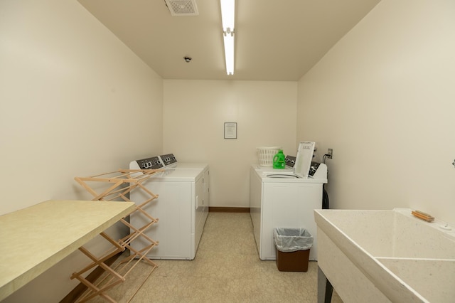 317 6th Ave SW Unit 501, Rochester, MN 55902 - laundry room with independent washer and dryer and a sink