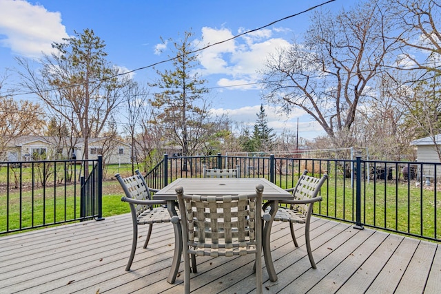deck with a lawn and outdoor dining area
