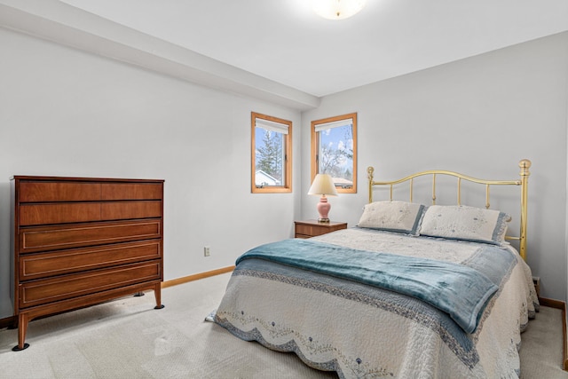 bedroom featuring baseboards and carpet floors