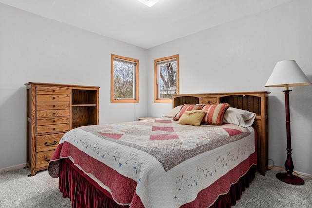 carpeted bedroom with baseboards