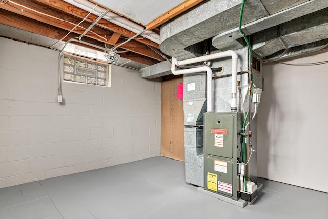 utility room featuring heating unit