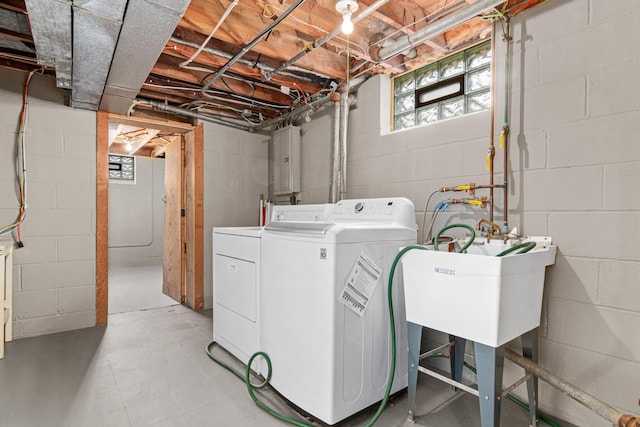 washroom with independent washer and dryer and laundry area