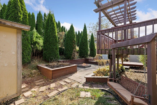 view of yard with a wooden deck and a pergola