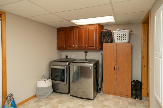 laundry area featuring cabinets and separate washer and dryer