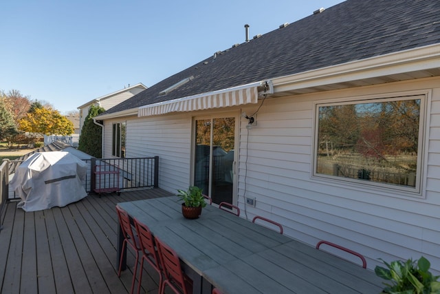 wooden deck featuring area for grilling