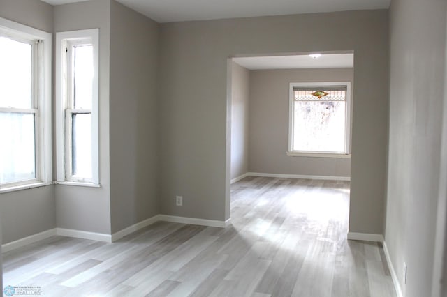 spare room with light wood-type flooring