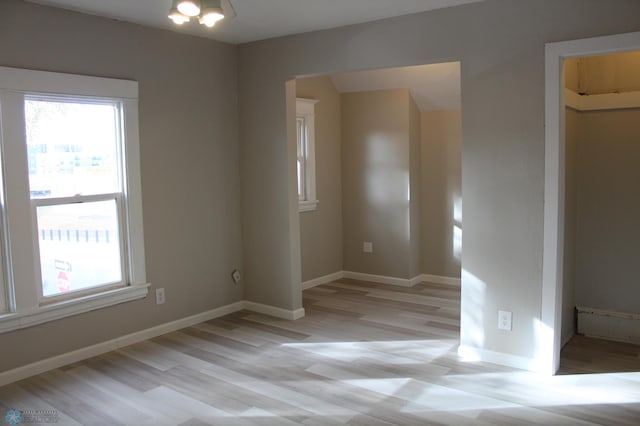 empty room with light wood-type flooring