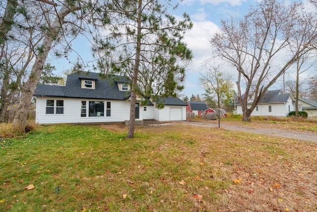 exterior space with a garage and a front yard