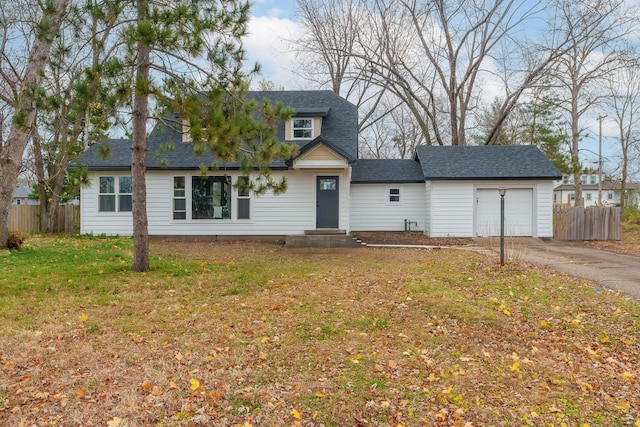 view of front of home featuring a garage and a front lawn