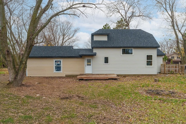 back of house with a wooden deck