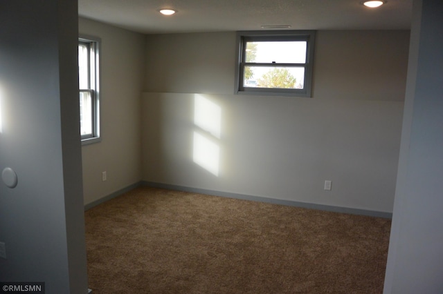 unfurnished room with carpet flooring