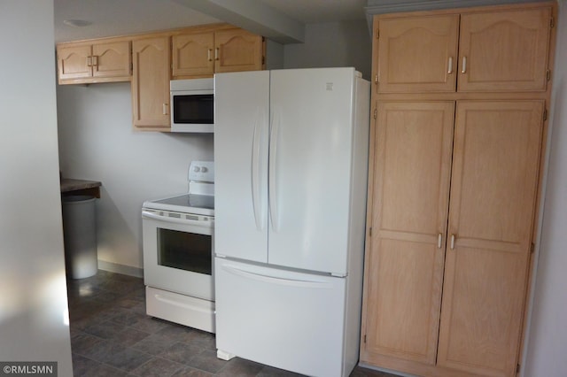 kitchen with light brown cabinets and white appliances