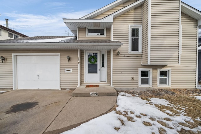 view of front facade with driveway and an attached garage