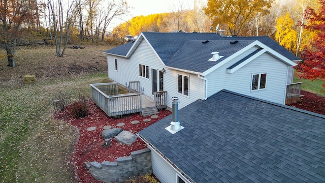 back of house with a wooden deck