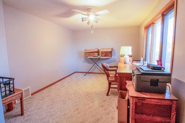 office featuring carpet flooring and ceiling fan