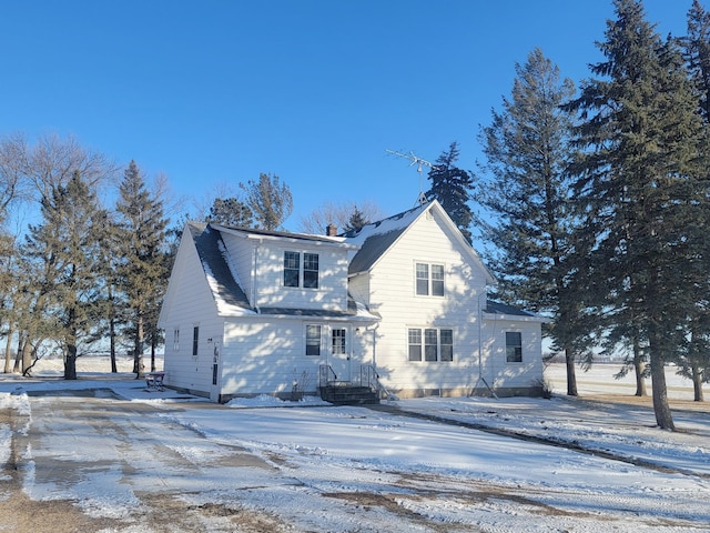 view of snow covered house