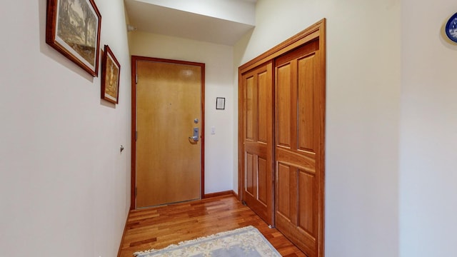 hallway with light wood-type flooring