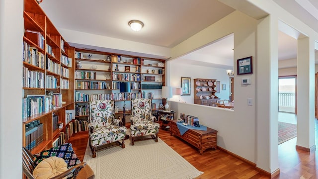 living area with hardwood / wood-style floors