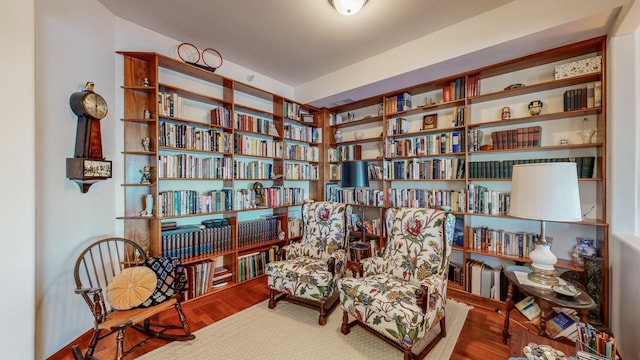 sitting room featuring hardwood / wood-style floors