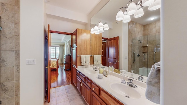 bathroom featuring vanity, hardwood / wood-style floors, and an enclosed shower