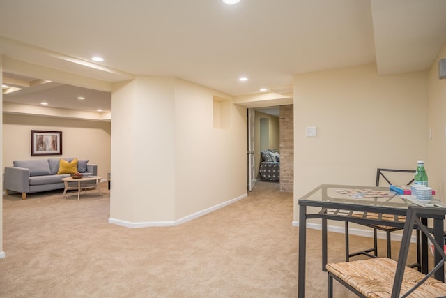 corridor featuring light colored carpet