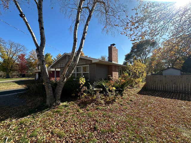 1031 Willmar Ave SW, Willmar, MN 56201 - view of side of home featuring a chimney