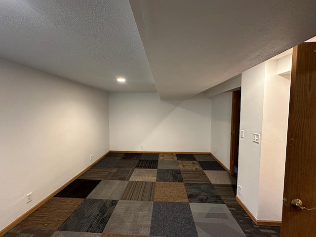 1031 Willmar Ave SW, Willmar, MN 56201 - finished basement with baseboards, a textured ceiling, and recessed lighting