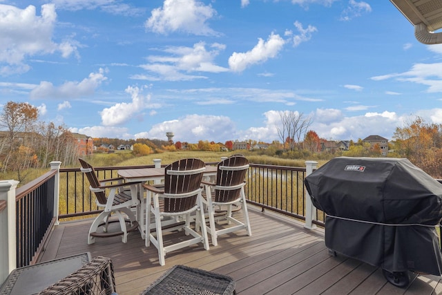 wooden deck featuring area for grilling