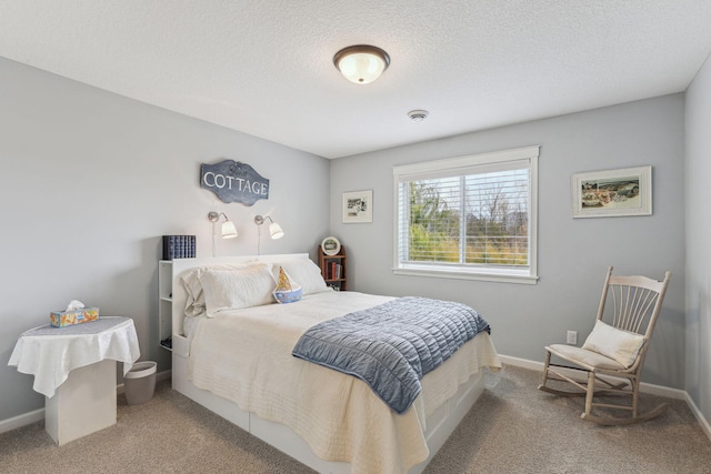 carpeted bedroom featuring a textured ceiling