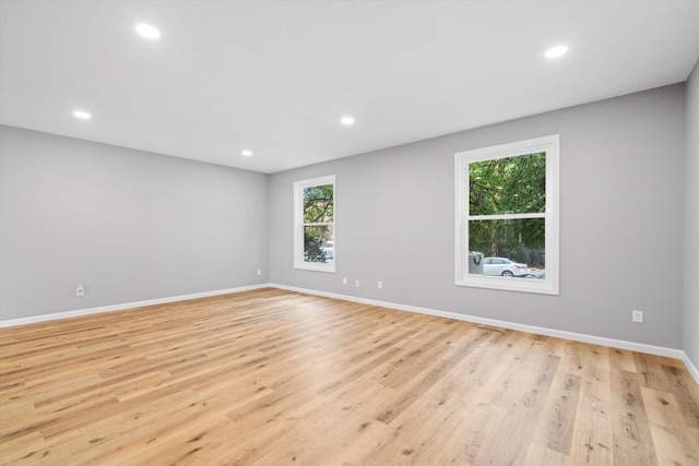 spare room featuring light hardwood / wood-style floors