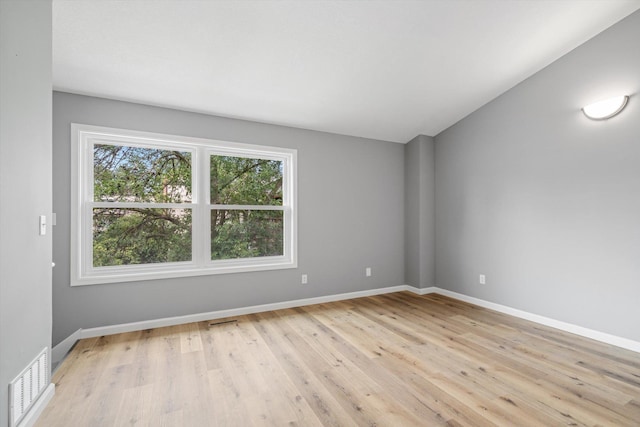 unfurnished room featuring light wood-type flooring