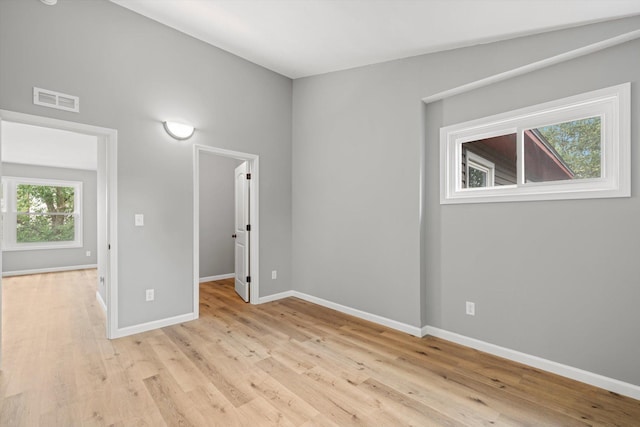 spare room with light hardwood / wood-style flooring