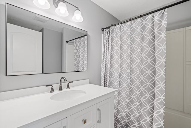 bathroom featuring vanity and shower / tub combo