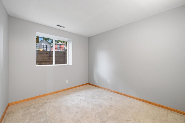 unfurnished room with carpet flooring