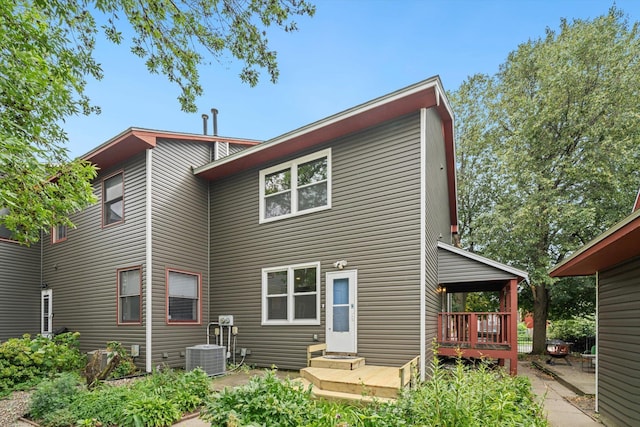 back of property featuring central AC and a wooden deck