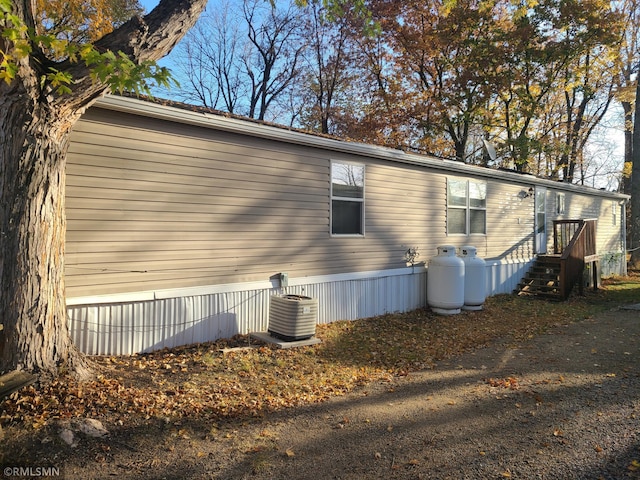 view of property exterior with central AC