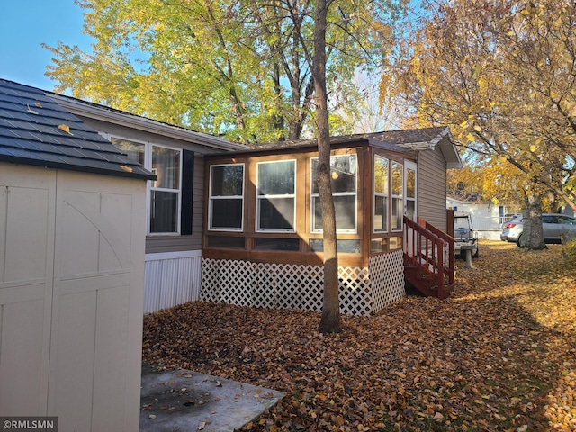 exterior space featuring a sunroom