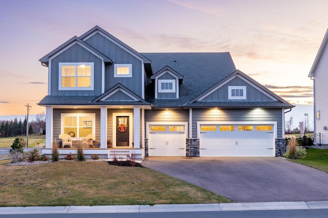 craftsman house featuring a yard and covered porch