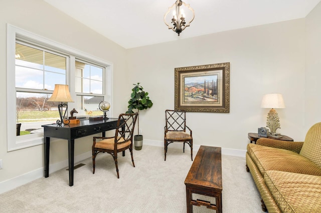 office space with light colored carpet and an inviting chandelier