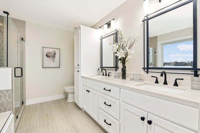 bathroom featuring vanity, tile patterned floors, toilet, and an enclosed shower