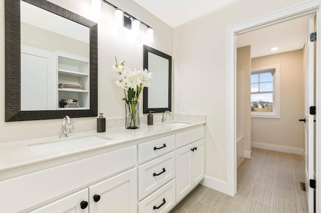 bathroom featuring vanity and a bathtub