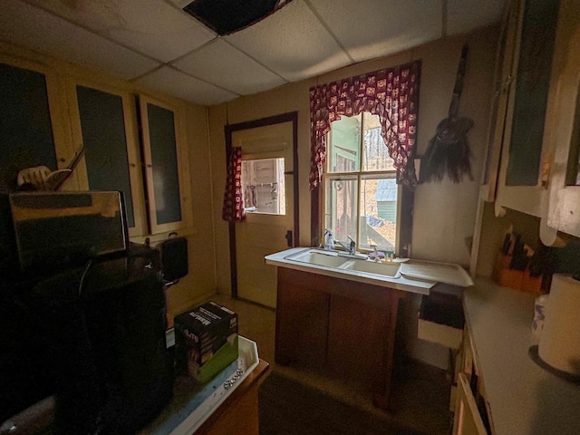 kitchen with a drop ceiling and sink