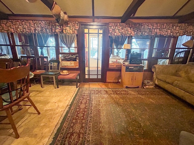 living room featuring beam ceiling