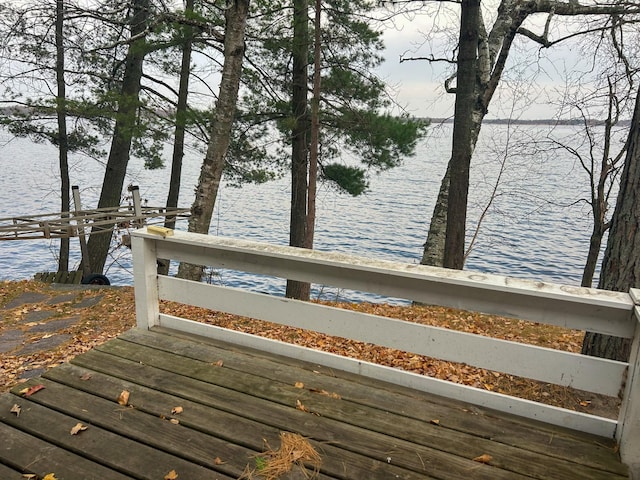 wooden deck with a water view