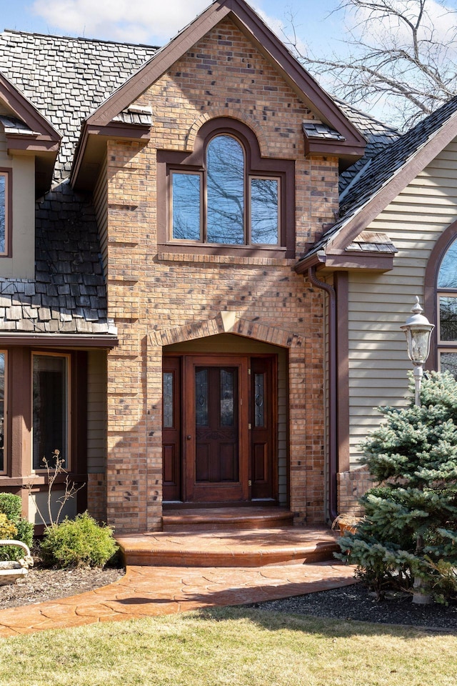 property entrance with brick siding