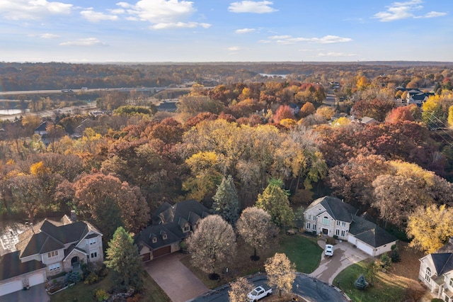 birds eye view of property with a forest view and a residential view