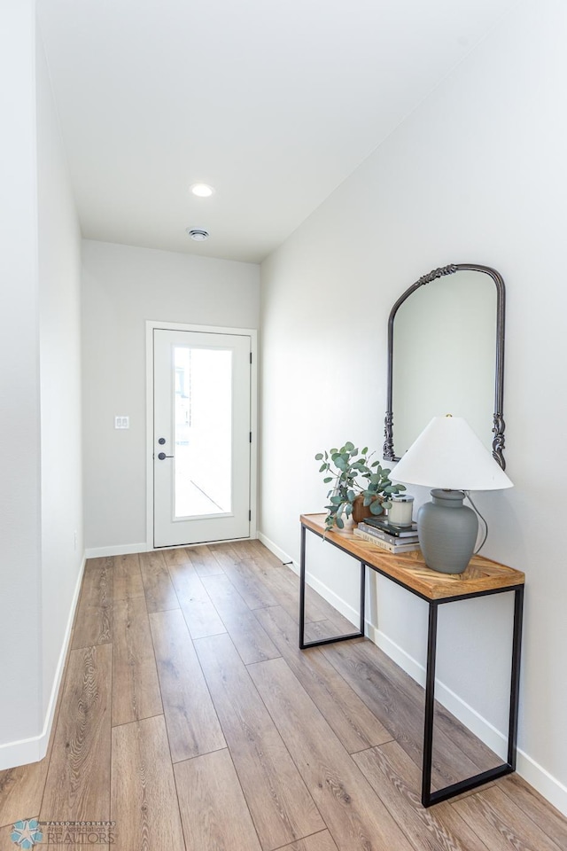 doorway to outside with light hardwood / wood-style floors